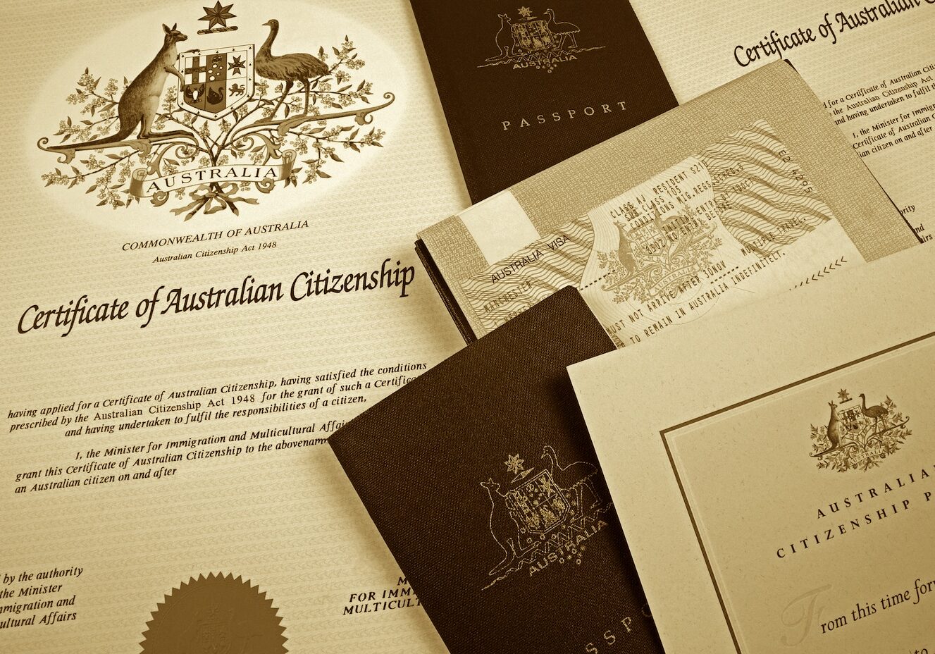 various australian citizenship documents and two passports